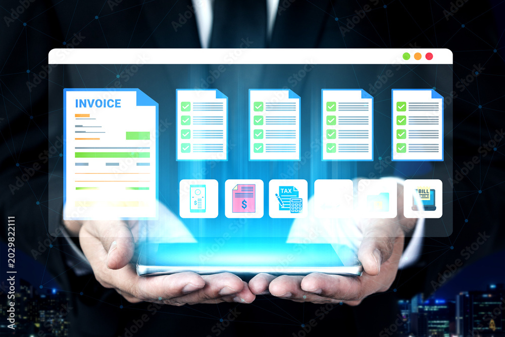 Fototapeta premium A businessman in a suit holds a digital screen displaying invoice and document icons, symbolizing modern financial management and tax compliance in today digital workplace. Ledger