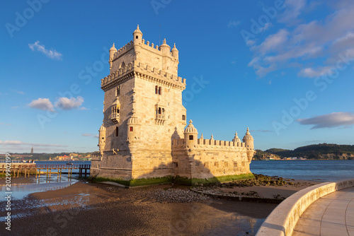 Tableau sur toile Belem Tower at low tide on Tagus River waterfront in Lisbon Portugal