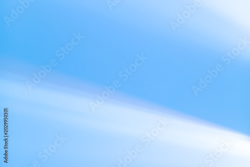 Light blue sky with light clouds. Copy space 