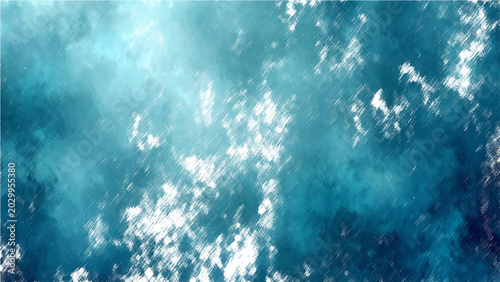 Fotografija Aerial view of ocean surface with white clouds floating and sunbeam shining through the clear blue water