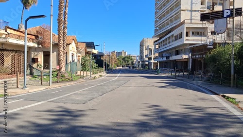 The district of Varosha in Famagusta (Northern Cyprus) was during its heyday, between 1970 and 1974,  one of the most popular tourist destinations in the world. It became a ghost town after the war