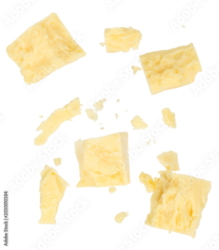 Tableau sur toile Crumbled parmesan cheese chunks and crumbs isolated background