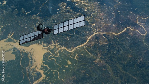 Satellite hovering over uncultivated region of planet earth globe with woods and rivers. NASA Public Domain Imagery