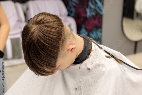 Obraz na płótnie overhead view of young boy head showing fresh bowl cut taper fade with cut hair