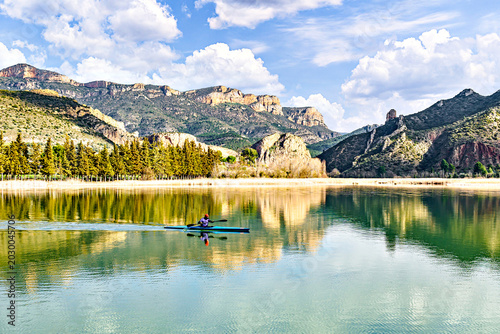 Canvastavla Man kayaking on the reservoir in the Sant Llorenç de Montgai Natural Park, Noguera region, Lleida, Catalonia