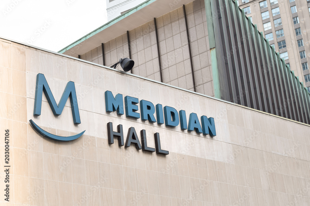 Naklejka premium Meridian Hall signage displayed on a building exterior in downtown Toronto, showing recognizable theatre and entertainment venue branding in an urban setting in May 2026