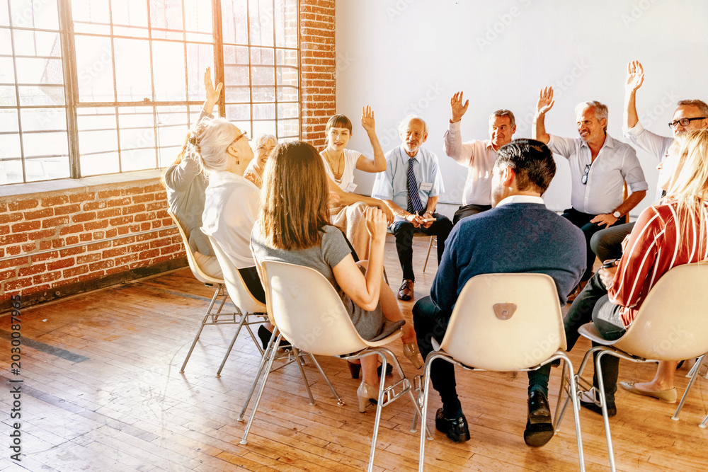 Fototapeta premium Team meeting with raised hands