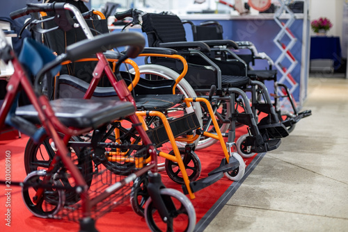 Bild auf Leinwand Wheelchairs Displayed at Medical Equipment Exhibition