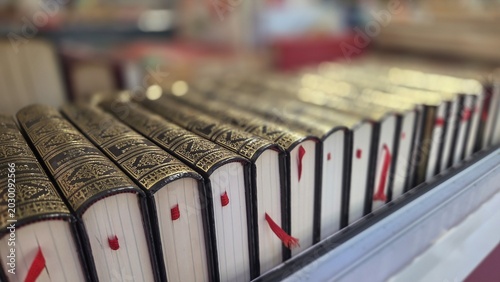Fotografie Close-up perspective of antique leather bound books with decorative gilded spine