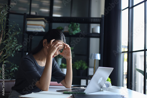 Obraz na plátně Beautiful women working in office, feeling sick and headache.