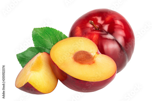 fresh red plum half with leaves isolated on white background
