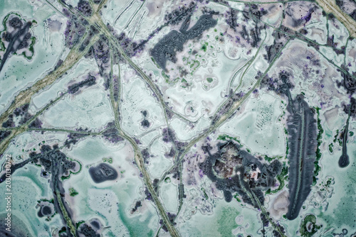 Fotografie Macro of unique tinguaite rock polished surface from Khibiny forming a microscop