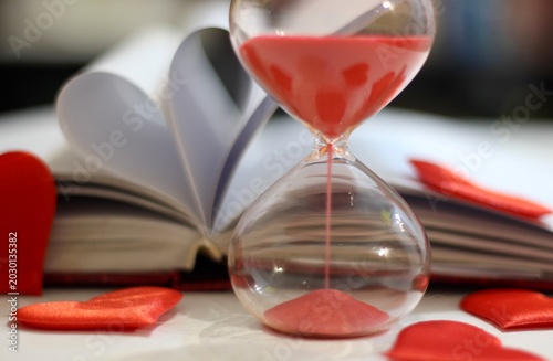 Konstfotografi Hourglass diary red hearts concept time for love passion romance photos