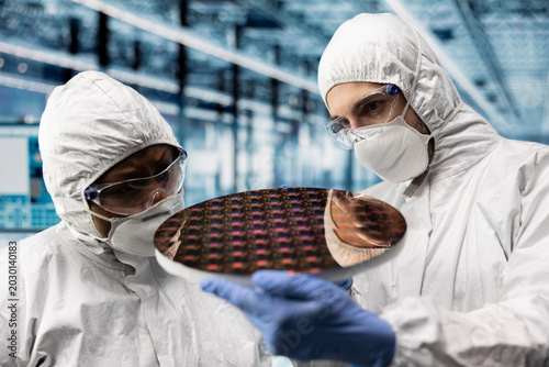 Schilderij op canvas Looking at semiconductor substrates, photolithography analysis and close up of qc engineers in smart factory