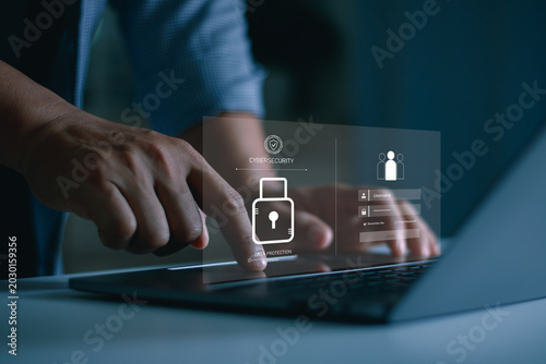 Cybersecurity and data protection concept with secure login interface on laptop. Businessman using digital authentication technology for online privacy, network security and cyber defense.