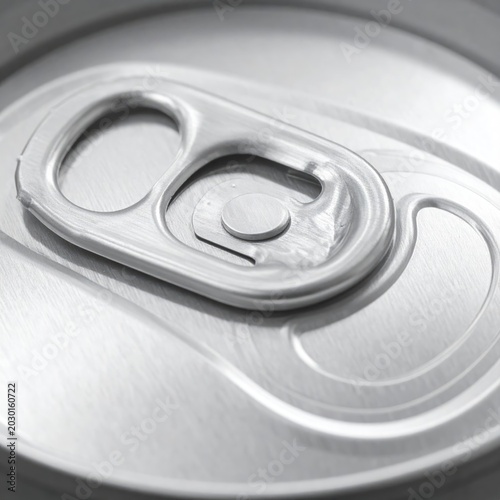 Extreme close-up of a silver beverage can tab and opening mechanism