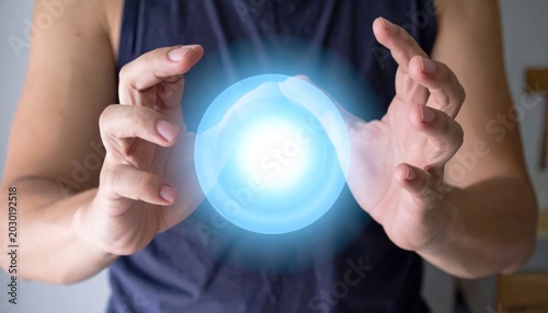 A Person Holding A Blue Ball In Their Hands