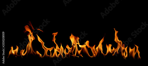 Εκτύπωση καμβά Realistic fire flames isolated on black background with glowing orange and yellow burning effect