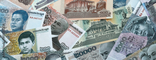 Tableau sur toile Cambodian riel money banknotes pile on table