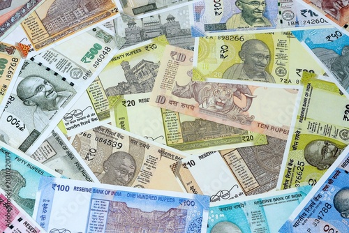 Indian rupee money bills in pile on table. India INR currency cash close up