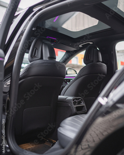 Fotografie Inside View of Modern Car Interior with Seats and Dashboard.