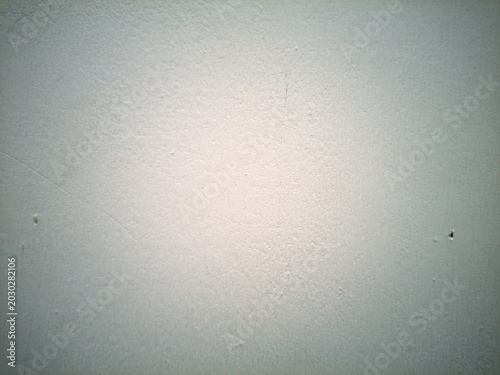 Tableau sur toile Close-up view of a plain, light-colored wall with a subtle textured surface and minor imperfections