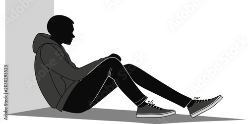 Bild auf Leinwand Depressed or tired young man silhouette sitting alone on the floor against a pla