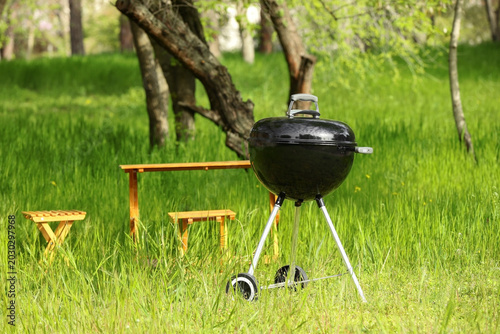 Modern brazier near table i...