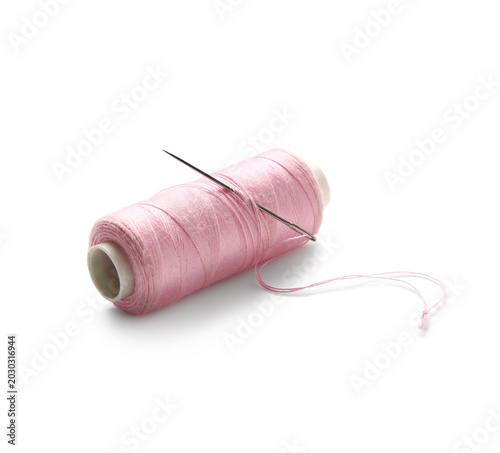 Pink sewing thread spool wi...