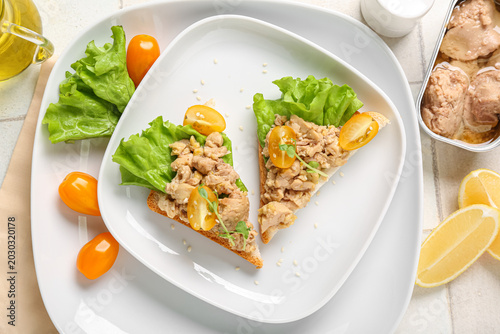 Plate of tasty sandwiches w...