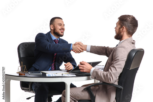 Happy businessmen shaking h...