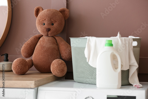 Toy bear and laundry basket...