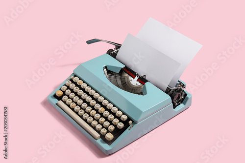 Vintage typewriter on pink ...