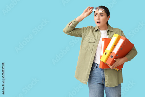 Shocked young businesswoman...