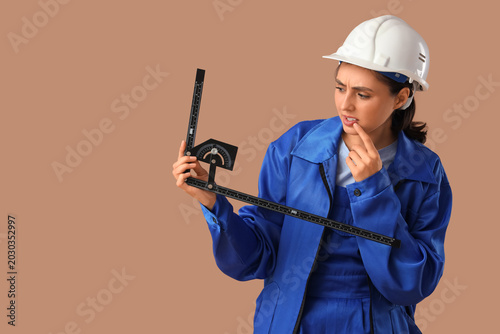 Thoughtful female worker wi...