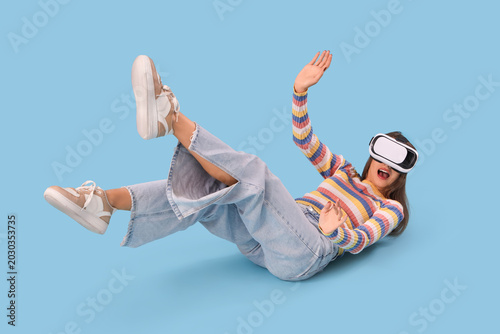 Young woman using VR glasse...