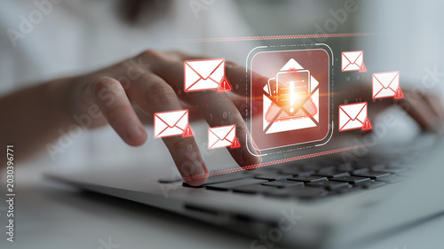Obraz na plátne Hand Using Laptop Keyboard with Email Alerts and Notifications Displayed on Scre
