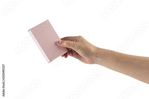 A small pink gift wrapping box and hand on transparent background.