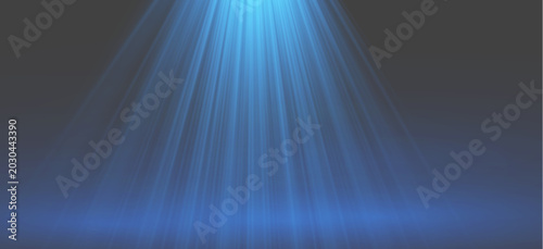 Abstract blue spotlight beams shining from above on empty dark stage backdrop with luxury bokeh shimmer