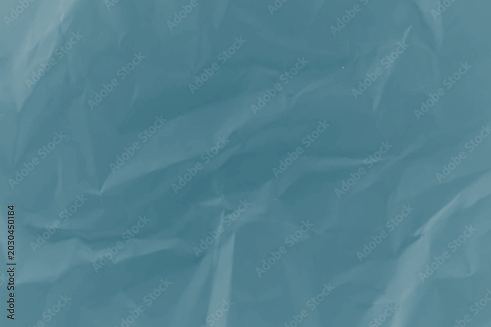 Obraz premium Crushed blue paper texture with soft light and copy space for design