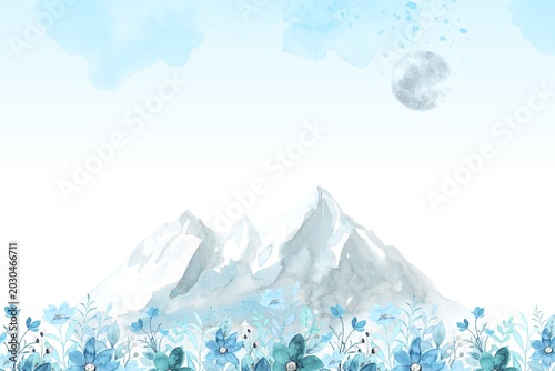 Snow-covered mountain peaks with clear blue sky and soft clouds in serene winter landscape