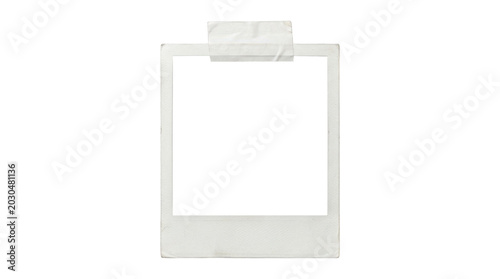 A blank white polaroid photo frame with tape on top isolated on transparent background