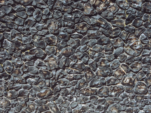 An example of a traditional flint wall, durable masonry construction made using flint nodules