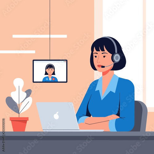 Woman with headset working on laptop in a video conference call