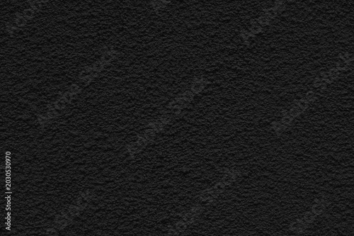 Foto Fine Grainy Plaster Texture with Uniform Relief Stucco Warm Black Surface