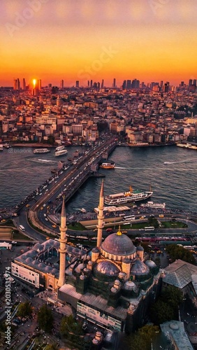 Beautiful sunset over Istanbul with Suleymaniye Mosque and ferry boat on the Golden Horn, Turkey