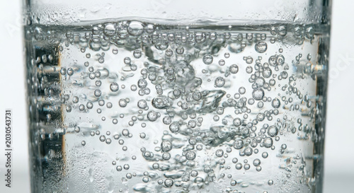 Clear water with bubbles in a glass container