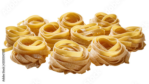Bild auf Leinwand Nestled fettuccine pasta nests uncooked and dry, isolated on transparent backgro