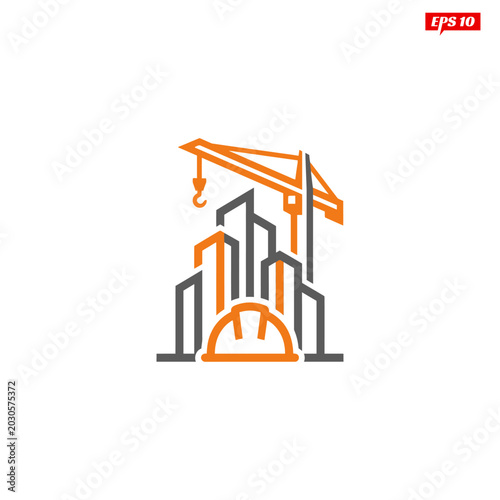 Construction site with crane and building outlines featuring a hard hat in the foreground.