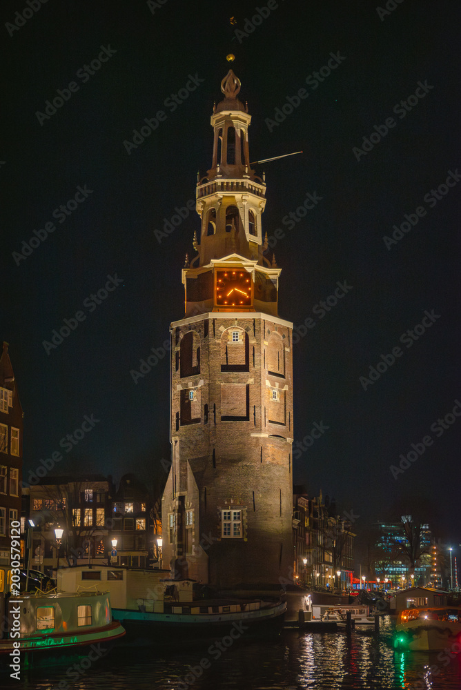 Obraz premium Amsterdam Skyline at Night Seen from the Water